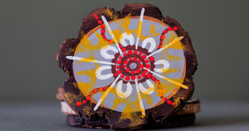 Image of an coaster painted with Aboriginal art