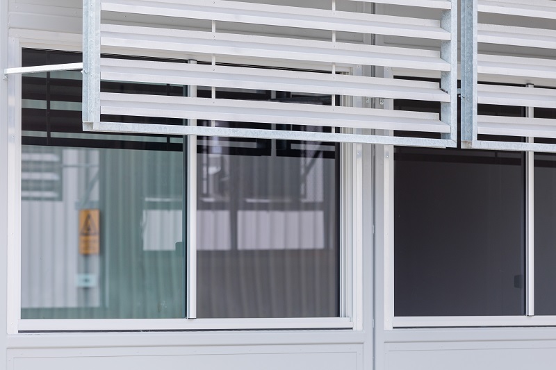 Image of an external demountable building with window and metal shading
