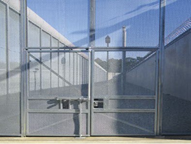 An image of a fence, high walls on both the sides