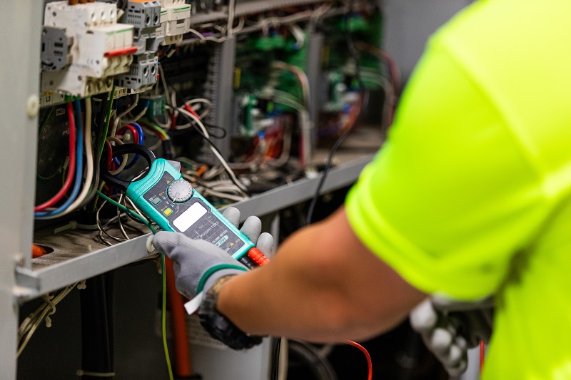 Person holding an electrical device
