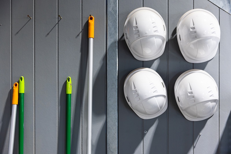 Hard hats hanging on a wall