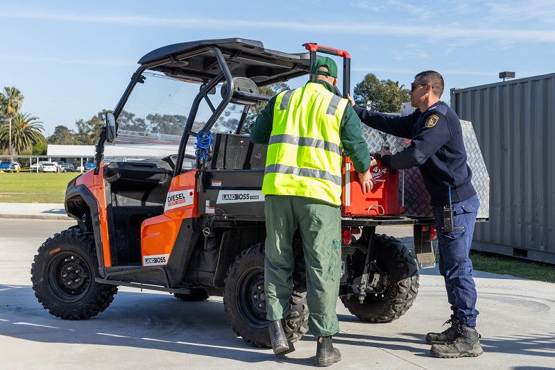People loading a work vehicle