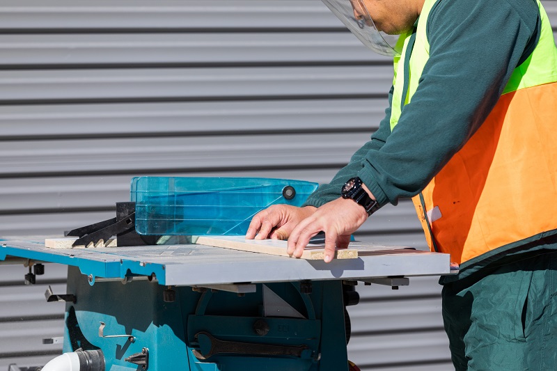 A person using a circular saw