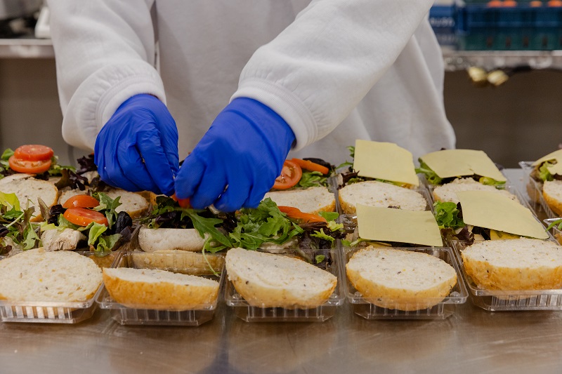 Person making salad rolls