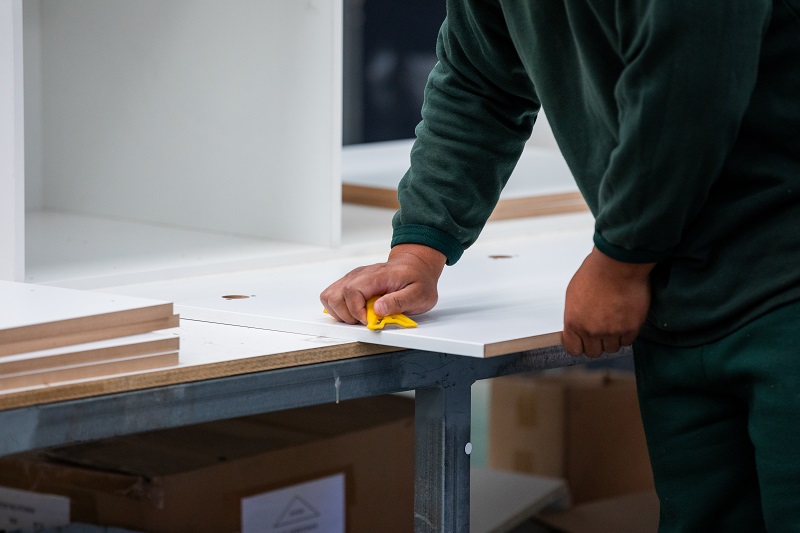 Person wiping joinery