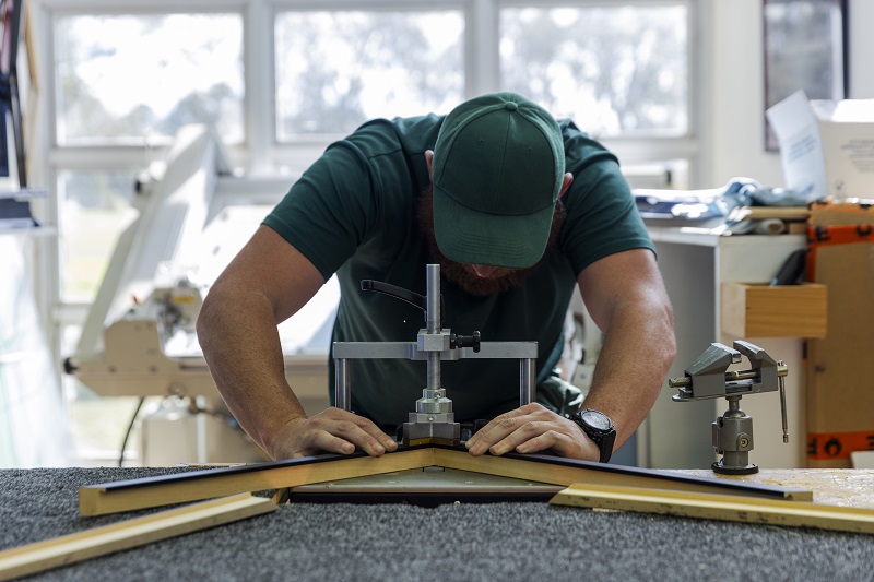 Person working with wooden frames