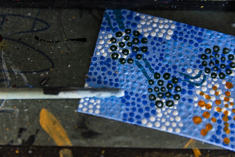Aboriginal art with paint brush