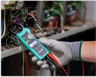 someone wearing a gloves and testing some electronic gadget