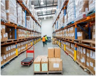 Two men walking through warehouse asile