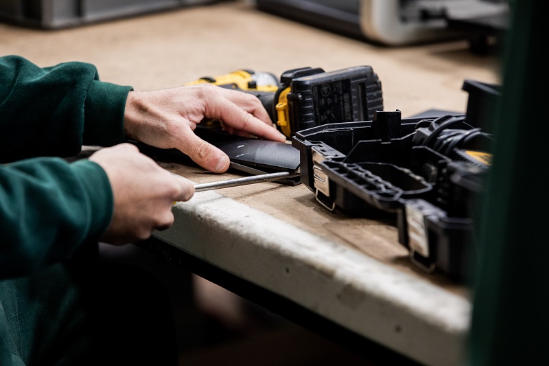 person working on small electrical item