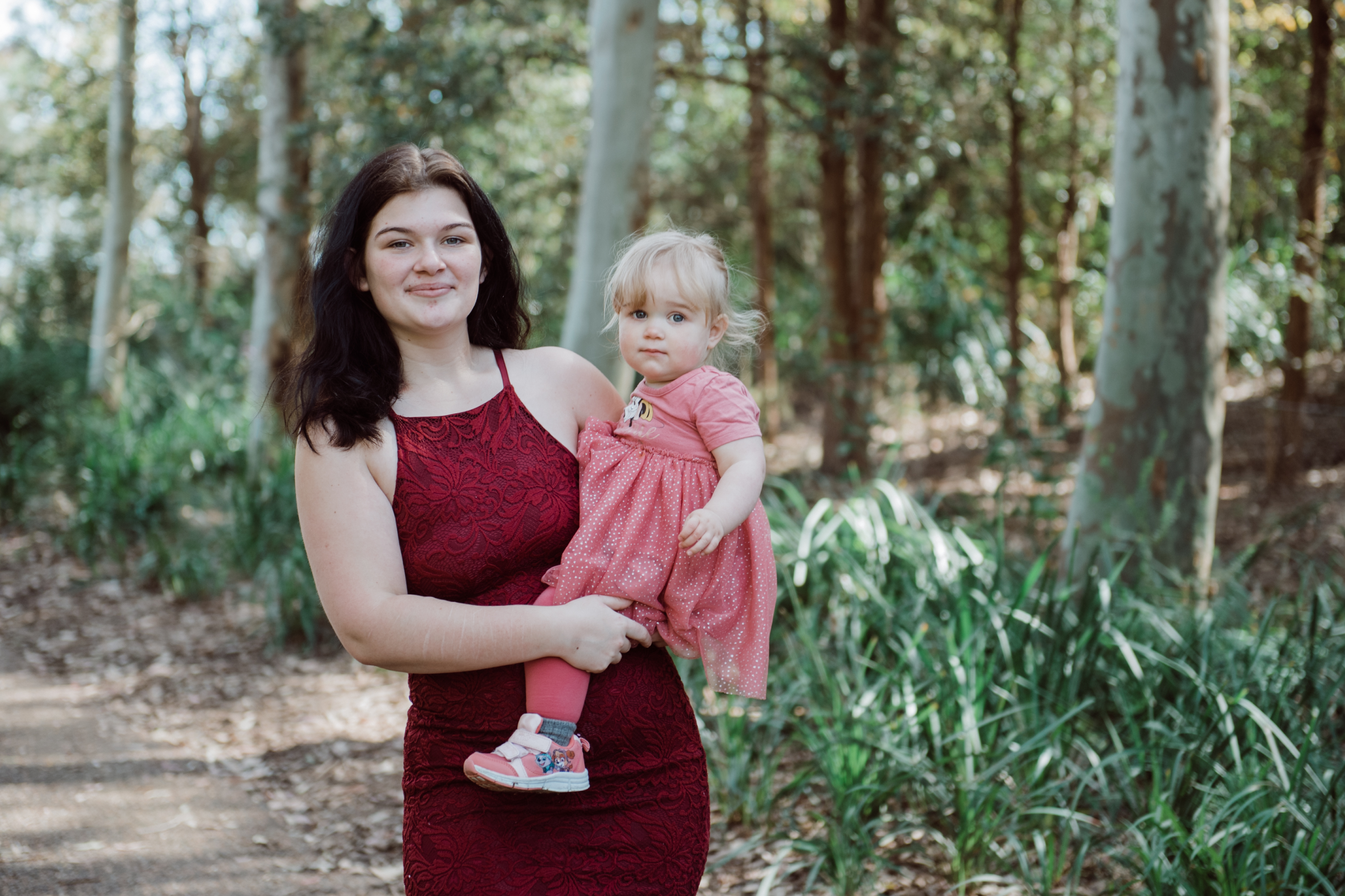 Photo of Elissia holding Ava and smiling
